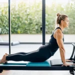 필라테스 강사 세금 처리 방법 - A professional female Pilates instructor, in her early 30s, with a fit and healthy physique, is grac...